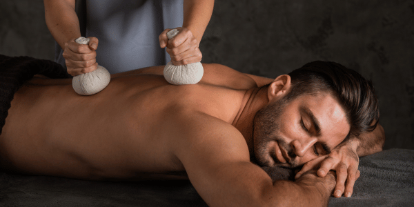 Professional male massage therapy session in Delhi spa